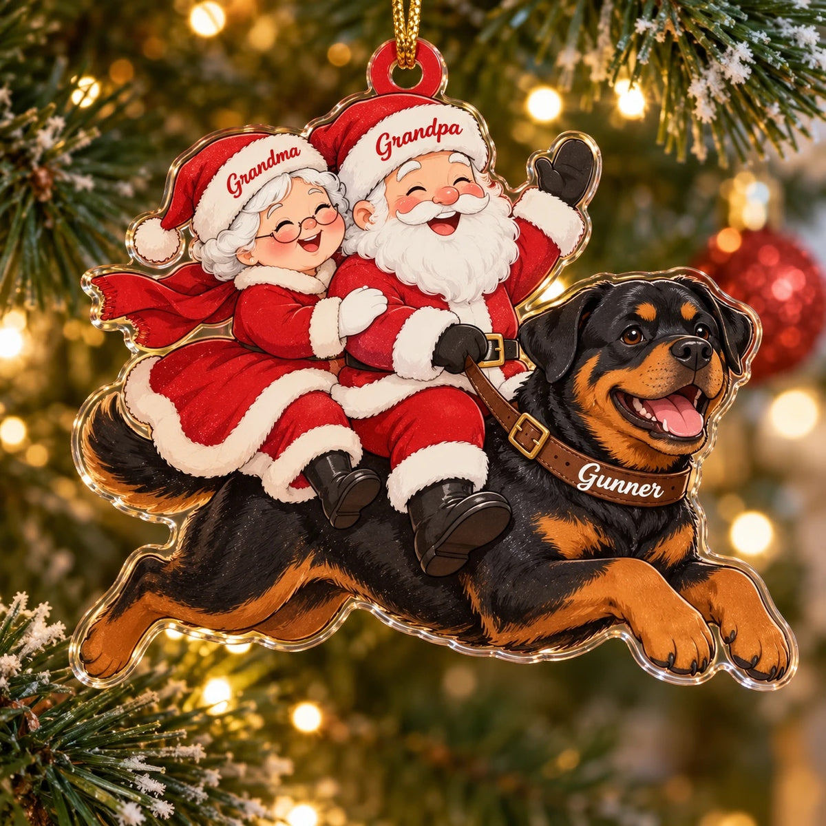 Acrylic ornament of Grandma and Grandpa Claus riding a leaping Rottweiler together, names on both hats and the dog's collar